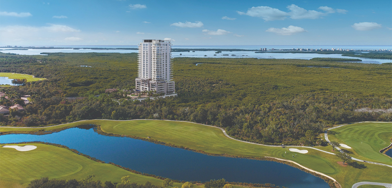Residential tower surrounded by wetlands and water.